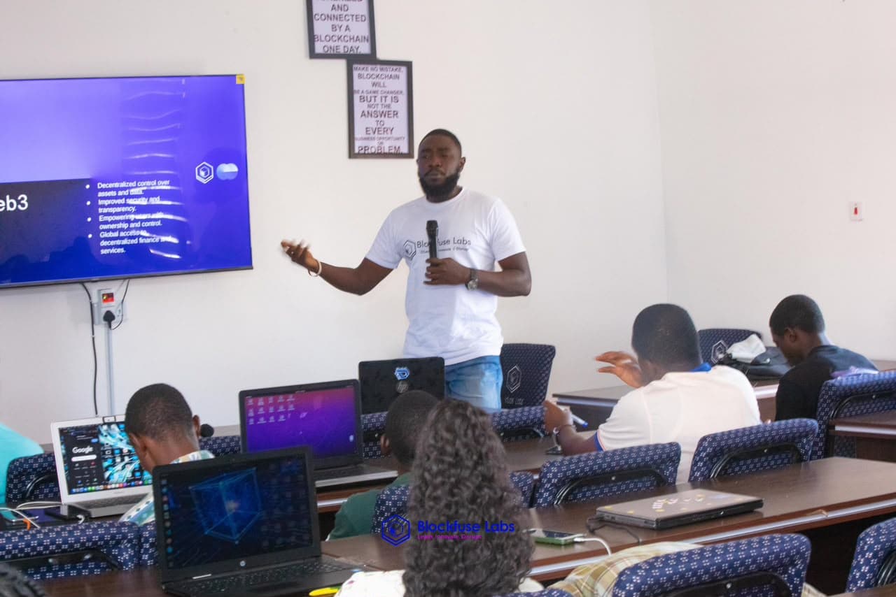 Emmanuel teaching a web3 cohort to a room of students